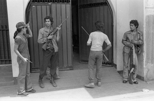 Sandinistas in front of a door, Nicaragua, 1979