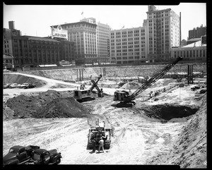 Heavy machinery excavating the site of the City Garage in Pershing Square, Los Angeles, 1951