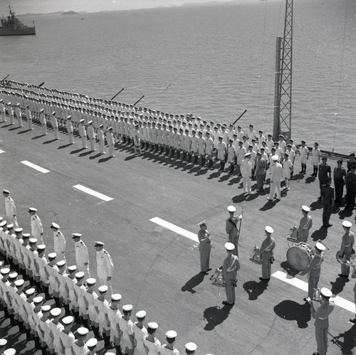 Ceremony on the deck of a British aircraft carrier