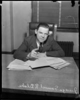 Juvenile Court judge Samuel R. Blake at desk with papers, [Los Angeles?], [1932?]