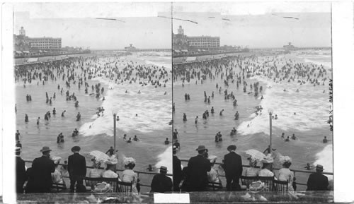 Crowded in surf at Atlantic City, looking N. from steel pier, New Jersey