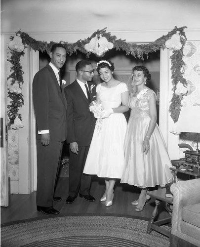 Couple with wedding guests, Los Angeles, ca. 1960