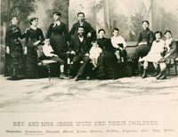 Rev. and Mrs. Jesse Wood and their children. Magnolia, Jessamine (Mrs. R. A. Green), Earnest, Hazel, Tison, Homer, Walton, Eugenia, Alice May, Willie