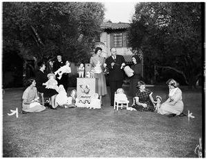 Making preparations for annual doll fair for Children's Hospital ...at the home of Mrs. Ridgway (not in picture), 355 South Rimpau Boulevard, 1951