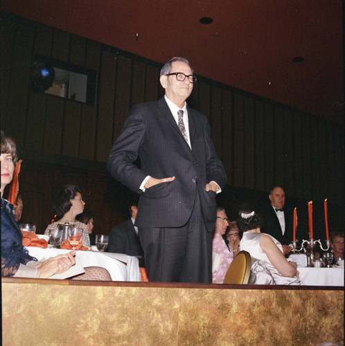 Unidentified man standing for recognition at Pepperdine's Birth of a College dinner, 1970