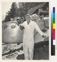 R. Stanley Dollar, Jr. posing with speedboat