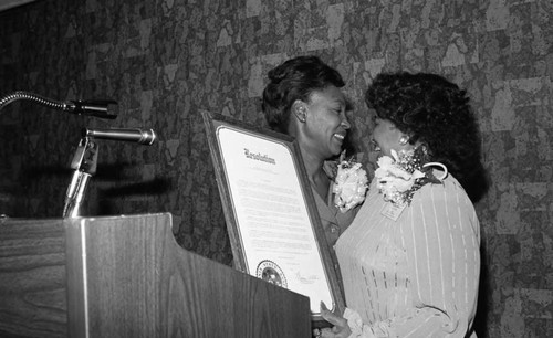Maxine Waters presenting a resolution during the 18th annual National Association of Media Women convention, Los Angeles, 1983