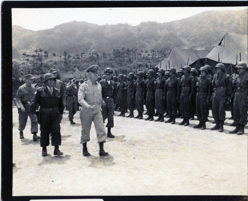 General J. Lawton Collins and party inspecting troops