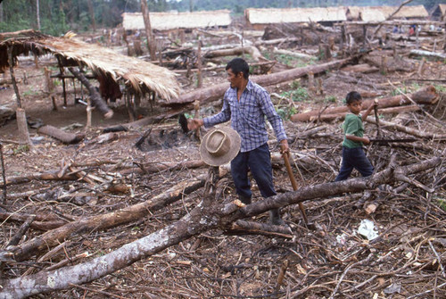 Guatemalan refugees chop wood, Chajul, ca. 1983