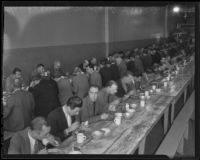 Men enjoy Thanksgiving dinner at the Midnight Mission, Los Angeles, 1935