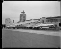 TWA aircraft, City of Los Angeles, sits outside the Grand Central Air Terminal for its dedication, Glendale, [1933]