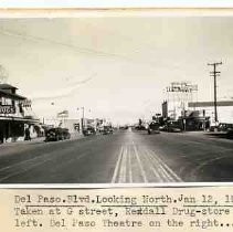 Del Paso Blvd. Looking North. Jan 12, 1940. Taken at G Street, Rexdall [sic] Drug-store on the left. Del Paso Theatre on the right
