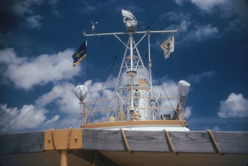 Crossing the Line ceremony, with Neptunus Rex flag flying from R/V Stranger mast, during Naga Expedition, December 1960