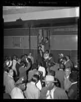 Ralph J. Bunche and family being greeted upon arrival at Los Angeles Union Station, 1949