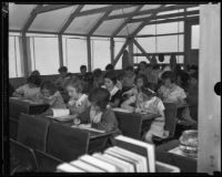 Los Angeles schoolchildren hard at work despite a dire learning environment, Los Angeles, 1935