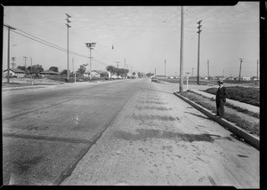 Skid marks at East 92nd Street and South Main Street with Mr. Weigel, Los Angeles, CA, 1931
