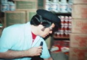 [Jim Jones showing supplies and provisions in the Jonestown warehouse]