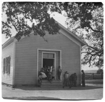Henry Meade Bland outside one-room schoolhouse