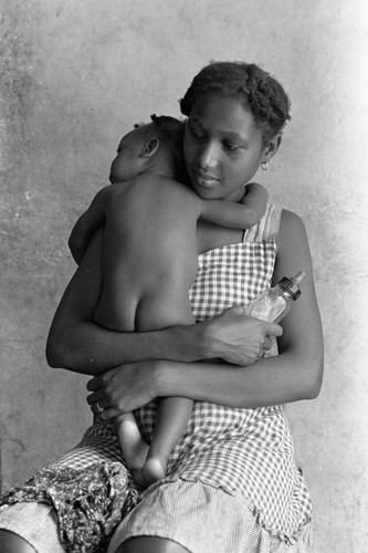Woman holding a baby, San Basilio de Palenque, 1976