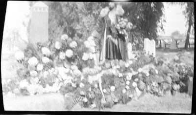 Unidentified woman at gravesite of Lucy Hinds