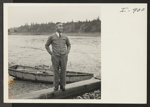Mr. George Yoshihara, formerly of Granada, is shown on the oyster float in front of his oyster beds. The Yoshiharas