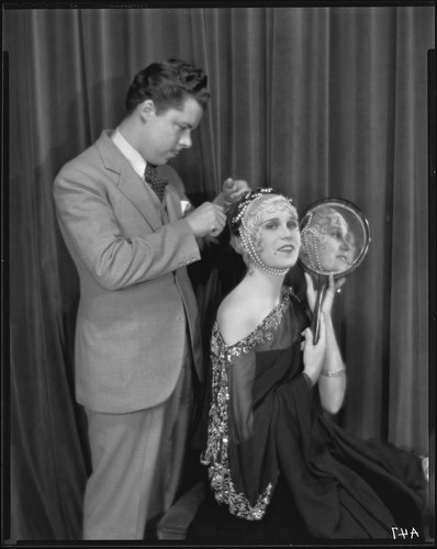 Peggy Hamilton modeling a headband with braided pearls, 1931