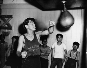 Rudy Jordan of the All Nations Boys Club practices on the speed bag, 1947
