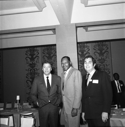 Tom Bradley posing with Burt Lancaster and Sydney Irmas, Jr. at a mayoral campaign event, Los Angeles, 1969