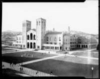 Royce Hall with students moving between classes on the Esplanade, 1930