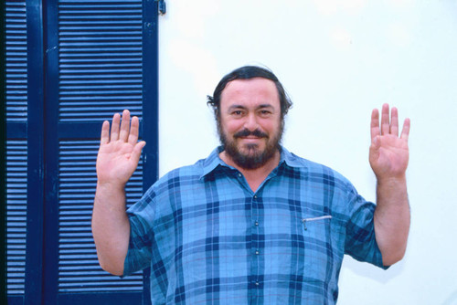 Luciano Pavarotti raising hands