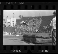 High Jumper Dick Fosbury clearing the bar during 1968 Olympic trials at Los Angeles Memorial Coliseum