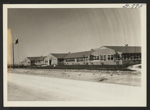 The Amache High School building looking towards the front from the south and west. Photographer: McClelland, Joe Amache, Colorado