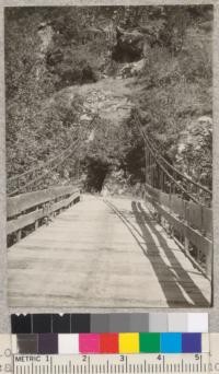 Suspension bridge across south fork of American River, showing anchorage and absence of supporting trestle. D. Bruce - May '23