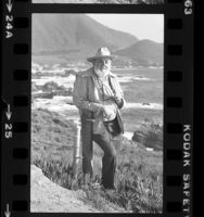 Ansel Adams, full length portrait taken along cliffs of Big Sur, Calif., 1980