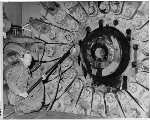 The large size of the Pelton wheels used at Big Creek can be seen from this picture taken during a repair project in 1948