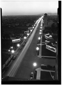 Birdseye view of Wilshire Boulevard, looking west at night, March 28, 1928