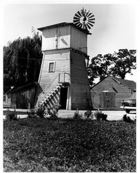 Tank house with windmill on an unidentified ranch, 1950s