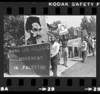 Demonstrators carrying signs, one reading "Long Live Islamic Movement in Palestine" at march in Los Angeles, Calif., 1982