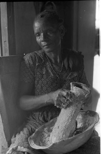 Woman grating coconut, San Basilio de Palenque, 1975