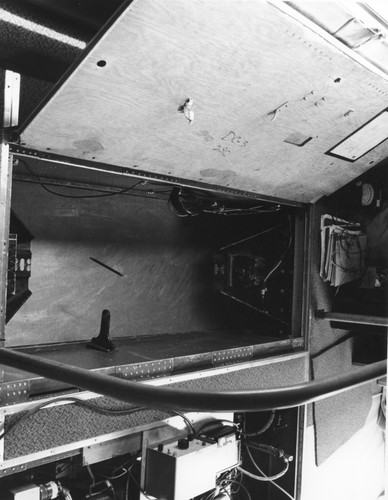 In 1962 Applied Oceanography Group (AOG) at Scripps Institution of Oceanography leased this DC-3 airplane. This photo shows some instruments and compartments in the plane. Later the plane would be given to them for continued research; AOG then mounted a infrared radiometer to measure heat flow from the ocean in the plane. With the airplane it was possible to survey 10,000 square miles of sea surface in 24 hours. Circa 1965