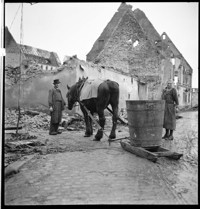 [Miscellaneous (Ammerschwihr?): "peasant" with horse and sledge with a barrel, among ruins of village]