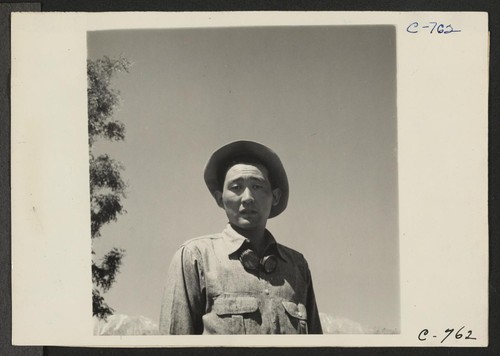 Manzanar, Calif.--Johnny Fukazawa, foreman of fields Nos. 3, 4, 5, and 6, and heading a 20-man crew on the farm project, says that there are many problems in farming here to cope with and solve with which evacuees of Japanese ancestry are not familiar. Photographer: Lange, Dorothea Manzanar, California