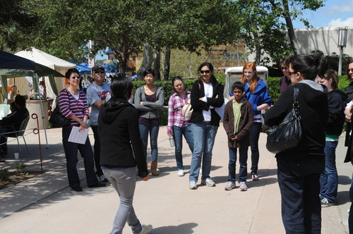 Student leading a campus tour on the Ring Mall; photograph at University of California, Irvine