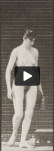 Nude woman descending stairs