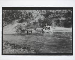 Overland mail stage crossing a river