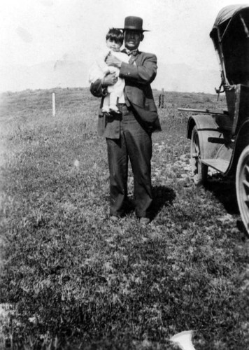 Man and child in a field