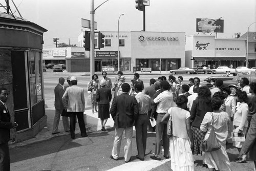 Crenshaw Community Redevelopment Association event on a street corner, Los Angeles, 1983