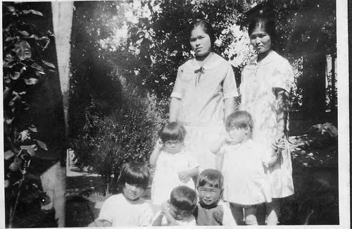 [Mrs. Taniguchi and family group]