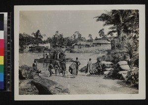 People crossing river by ferry, Ghana, 1926