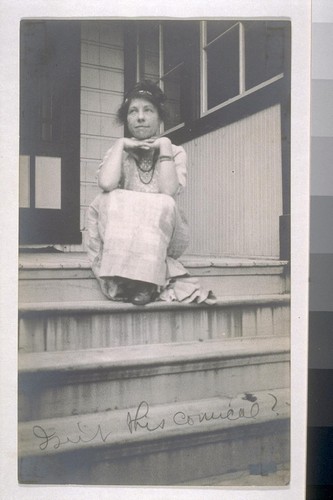 [Charmian Kittredge London sitting at top of steps.]